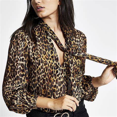 leopard print tie neck blouse.